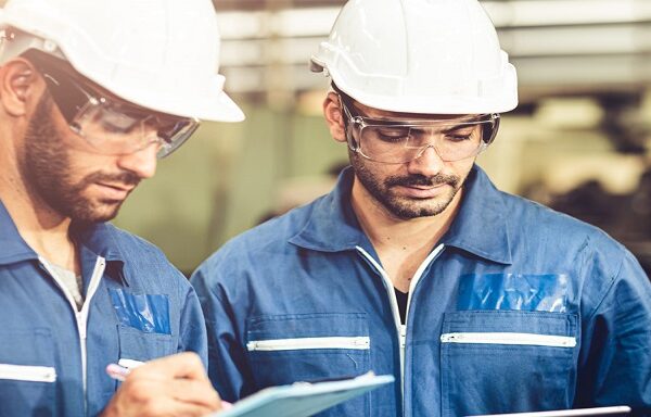 Engineer audit worker working team together with safety uniform Engineer audit worker working team together with safety uniform and white helmet to work in industry factory handle tablet and checklist.